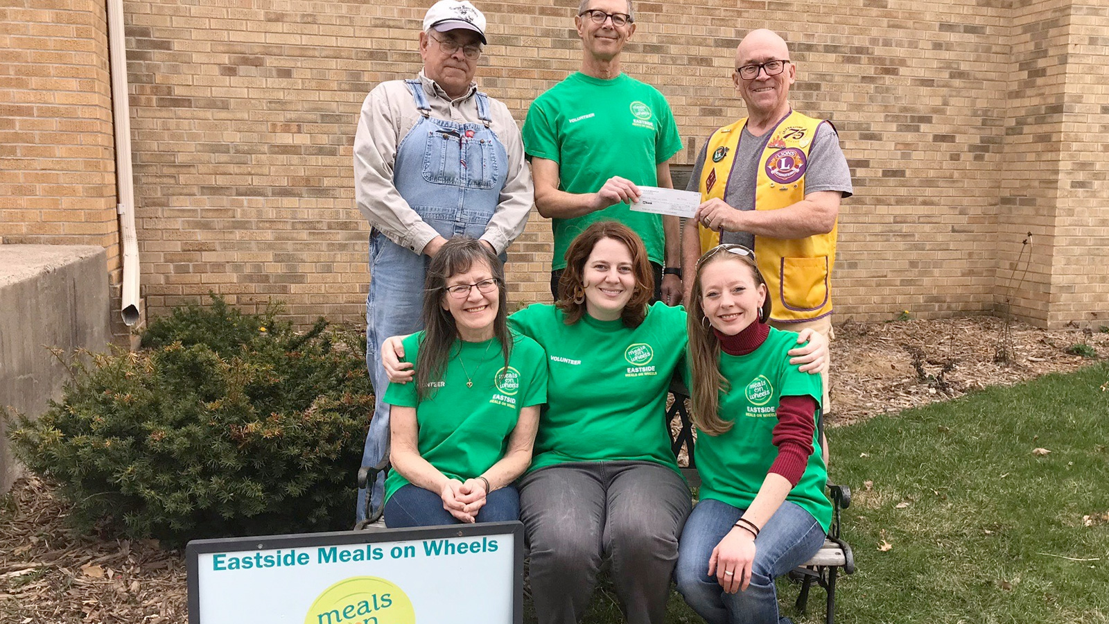 EMOW board and employees pose with the Lions Club